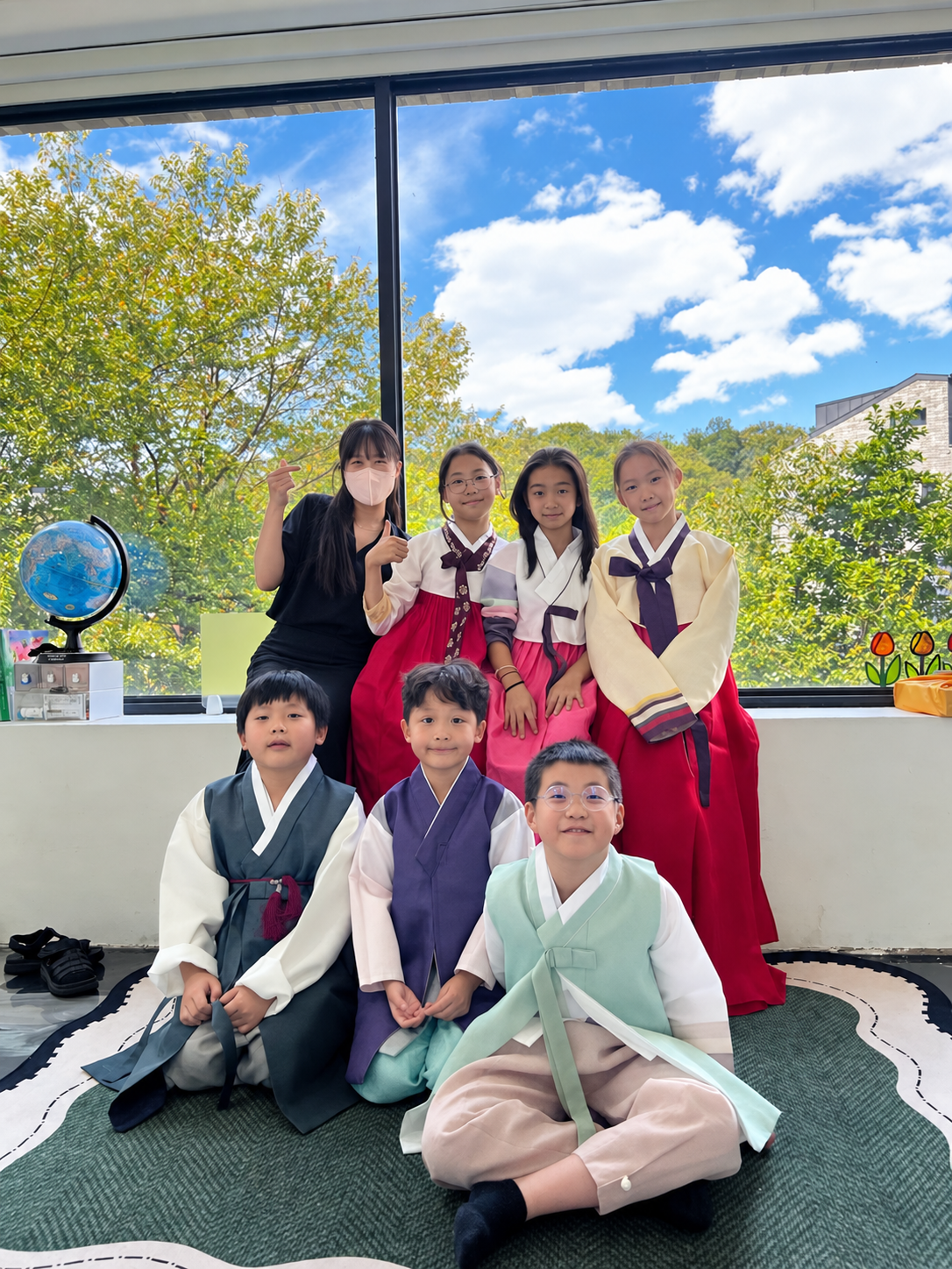 Primary students and teachers dressed in hanbok for Chuseok